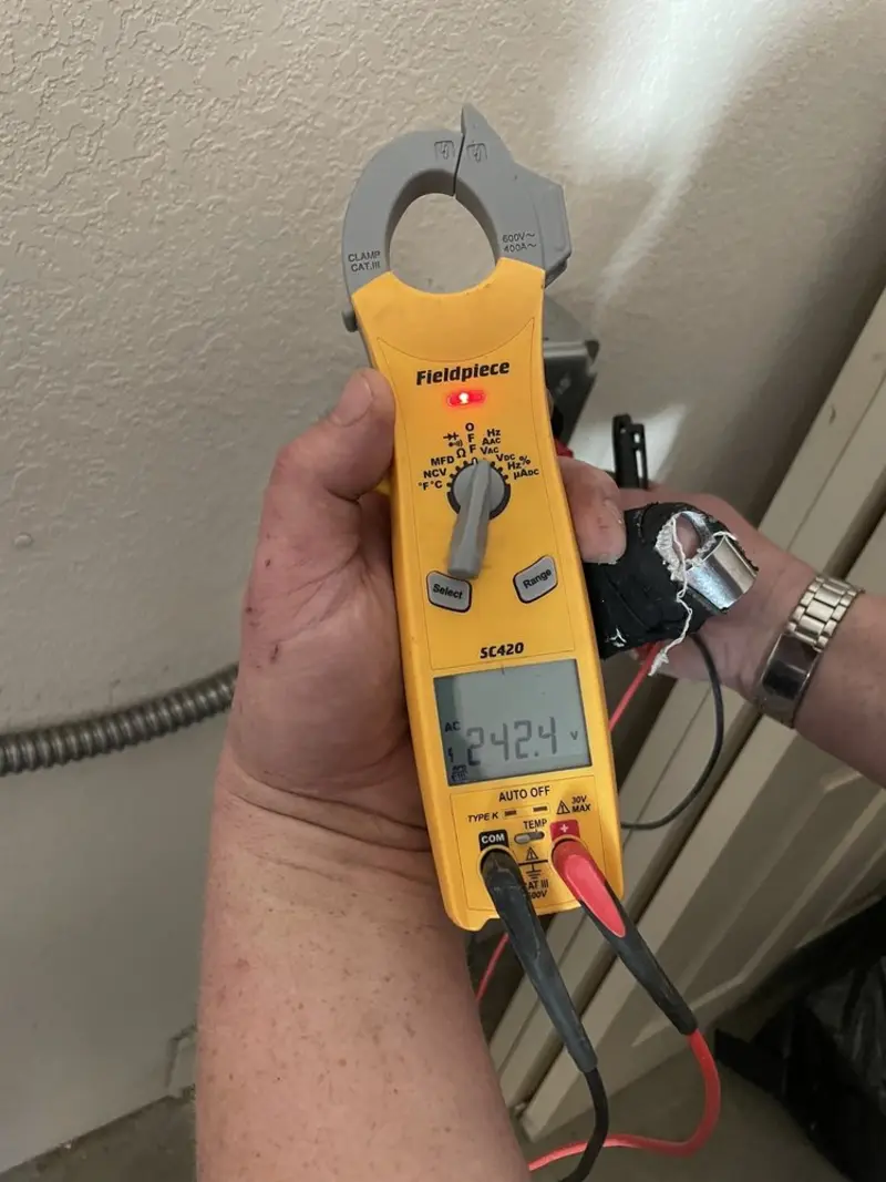 Voltage testing with clamp meter during Whole House Surge Protector in Gadsden